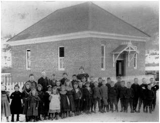 1898, Children stand in front of the brick Clinton School